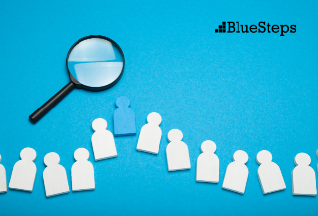 Magnify Glass on a Blue Background with paper cut outs of people